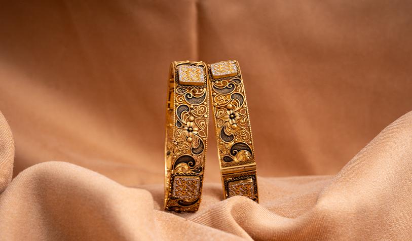 Intricate gold and diamond bangle