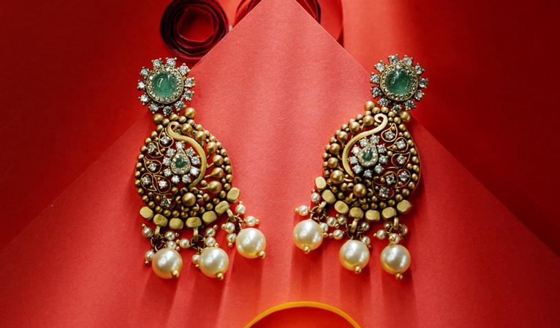 Diamond earrings on a display stand